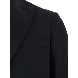 Single-breasted suit with peak revers in black fabric and long sleeve jacket for men