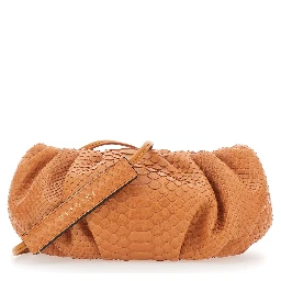 Pillow Orange Clutch with shoulder strap and magnetic closure in leather for women
