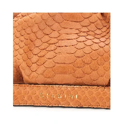 Pillow Orange Clutch with shoulder strap and magnetic closure in leather for women