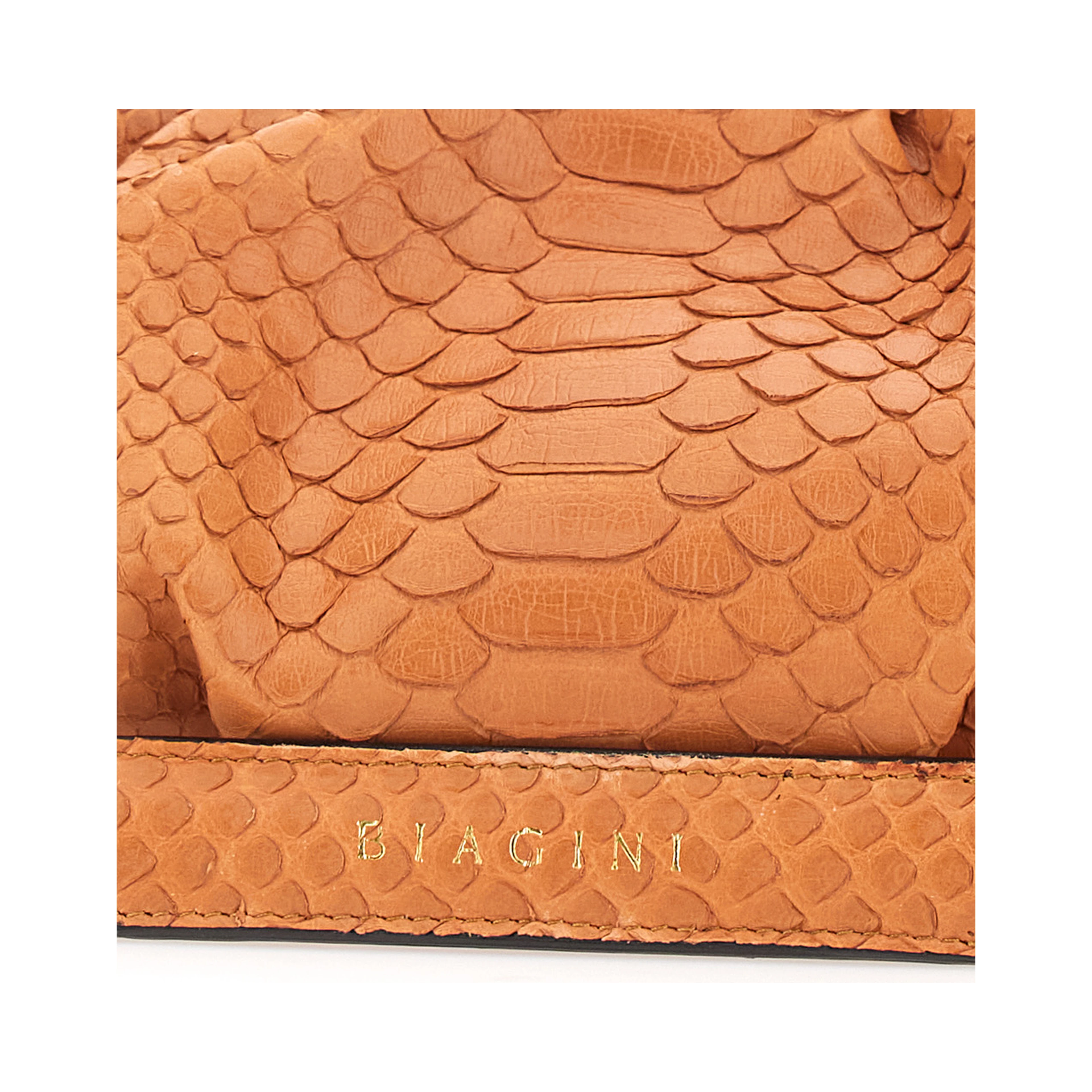 Pillow Orange Clutch with shoulder strap and magnetic closure in leather for women