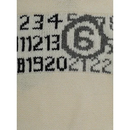 M61048MM08VMM6K62UM6101 is a sweater with a round neckline and long sleeves made of Wool and Nylon in Light blue for Boy