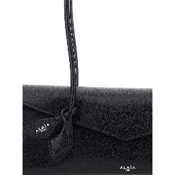 Shoulder bag TECKEL FLAP MEDIUM with leather details and ALAIA logo, black, women