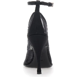 High-heeled pumps characterized by a glossy finish in black leather and an elegant design for women
