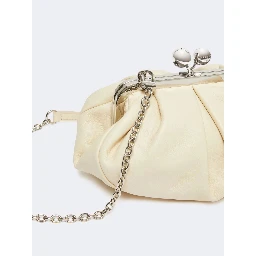 WEEKEND MAX MARA is accompanied by a handbag