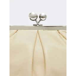 WEEKEND MAX MARA is accompanied by a handbag